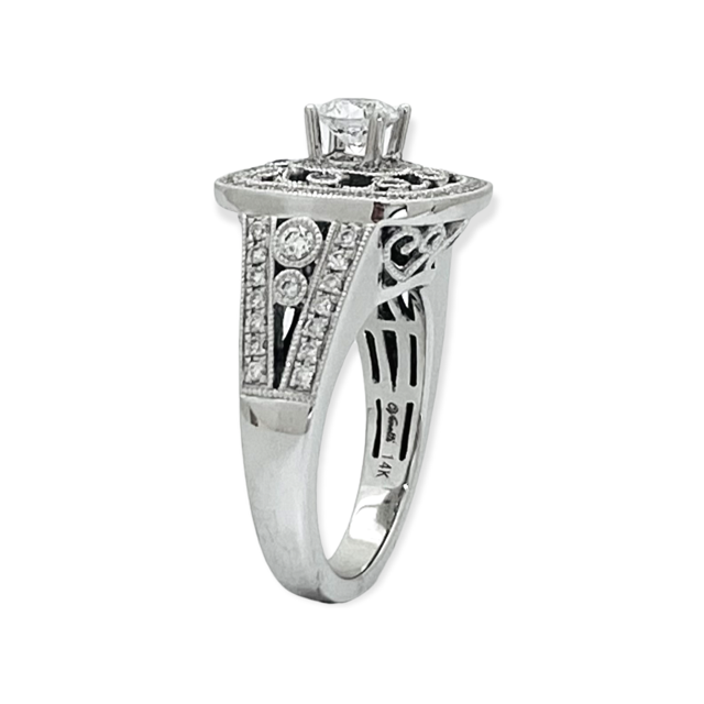White gold four-prong solitaire ring semi-mount with an empty center on a plain band