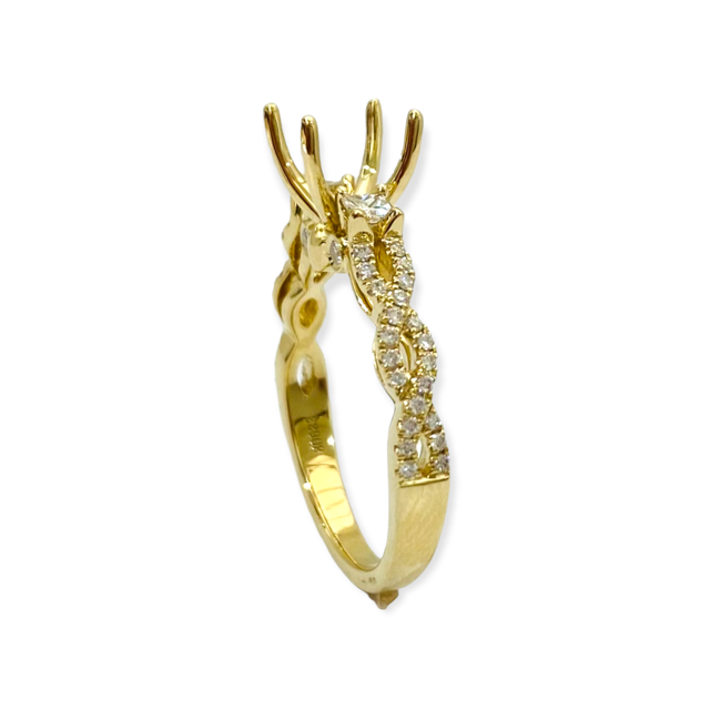 Yellow gold diamond engagement ring semi-mount three-quarter view with empty four-prong head and twisted diamond band