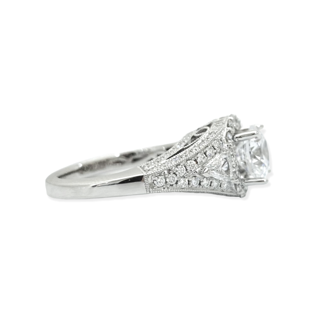 White gold cushion diamond halo engagement ring three-quarter view with pave gallery