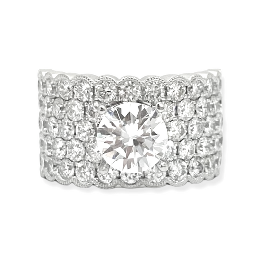 White gold wide diamond band ring with round center stone and multi-row pave scalloped edges