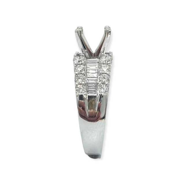 White gold diamond engagement ring semi-mount side view showing empty prong head and baguette accents