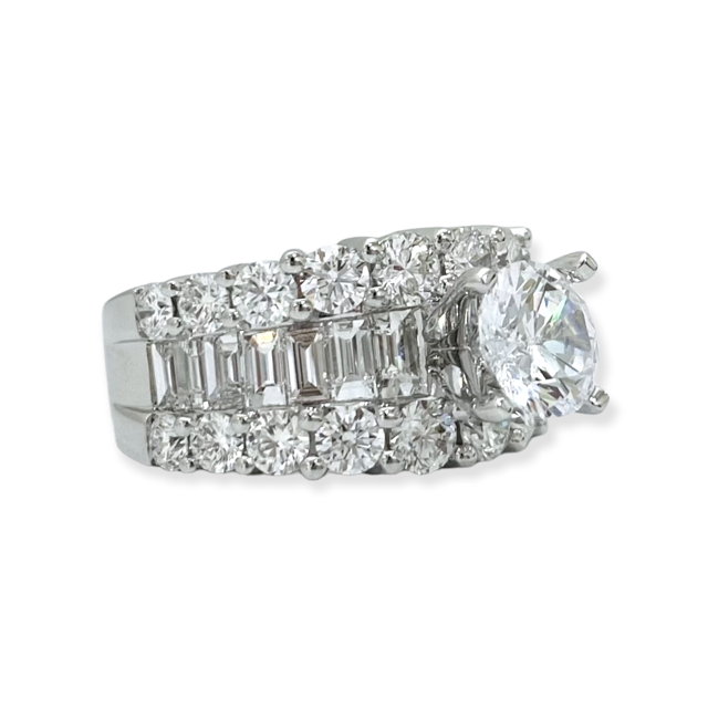 White gold round diamond wide band ring three-quarter view showing baguette and round diamond rows