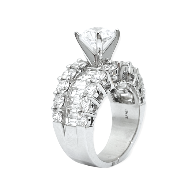 White gold diamond engagement ring profile view with round center and baguette band, stock number 32761