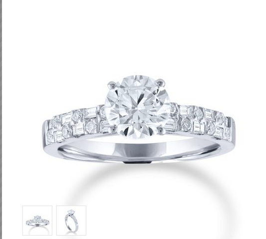 White gold round diamond engagement ring with two rows of alternating round and baguette diamonds on the band