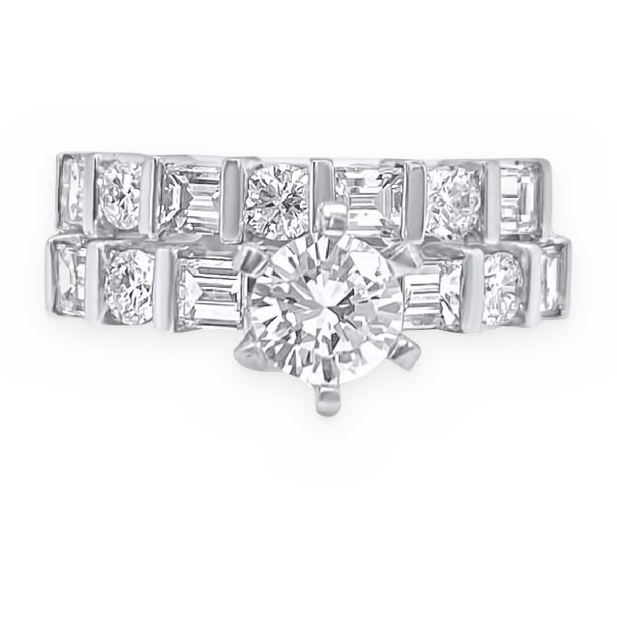 White gold diamond bridal set with round solitaire and bar-set baguette wedding band, top-down view