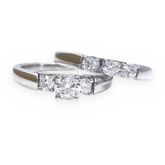 White gold round diamond engagement ring with matching diamond wedding band
