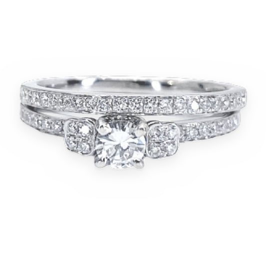 White gold round diamond engagement ring with pave-set shoulders and band