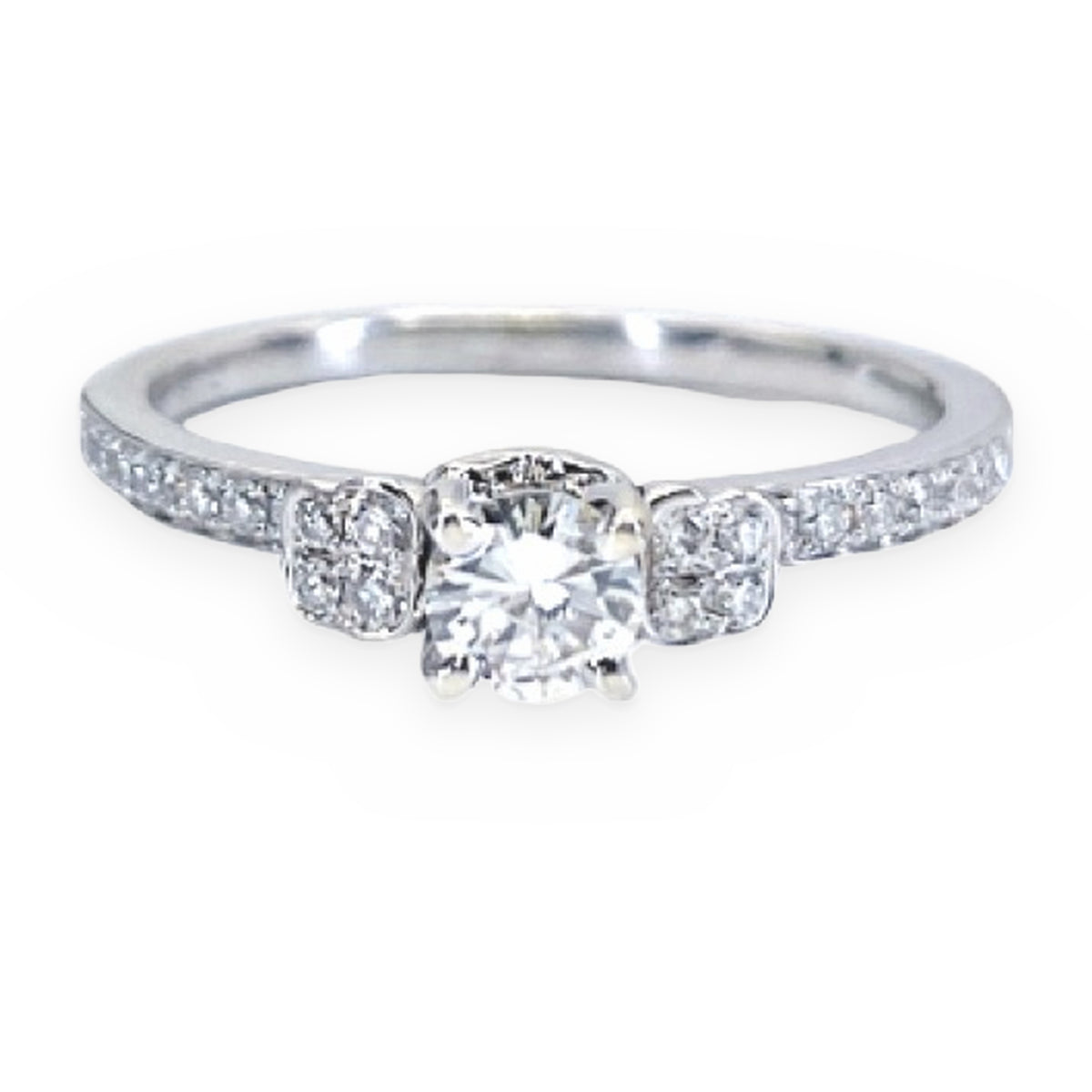 White gold round diamond engagement ring with square diamond accents and pave shoulders