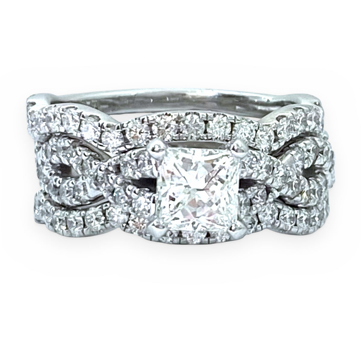 White gold princess-cut diamond halo engagement ring with twisted diamond bands