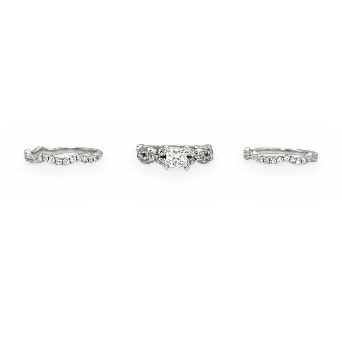 White gold princess-cut diamond engagement ring with two scalloped diamond wedding bands