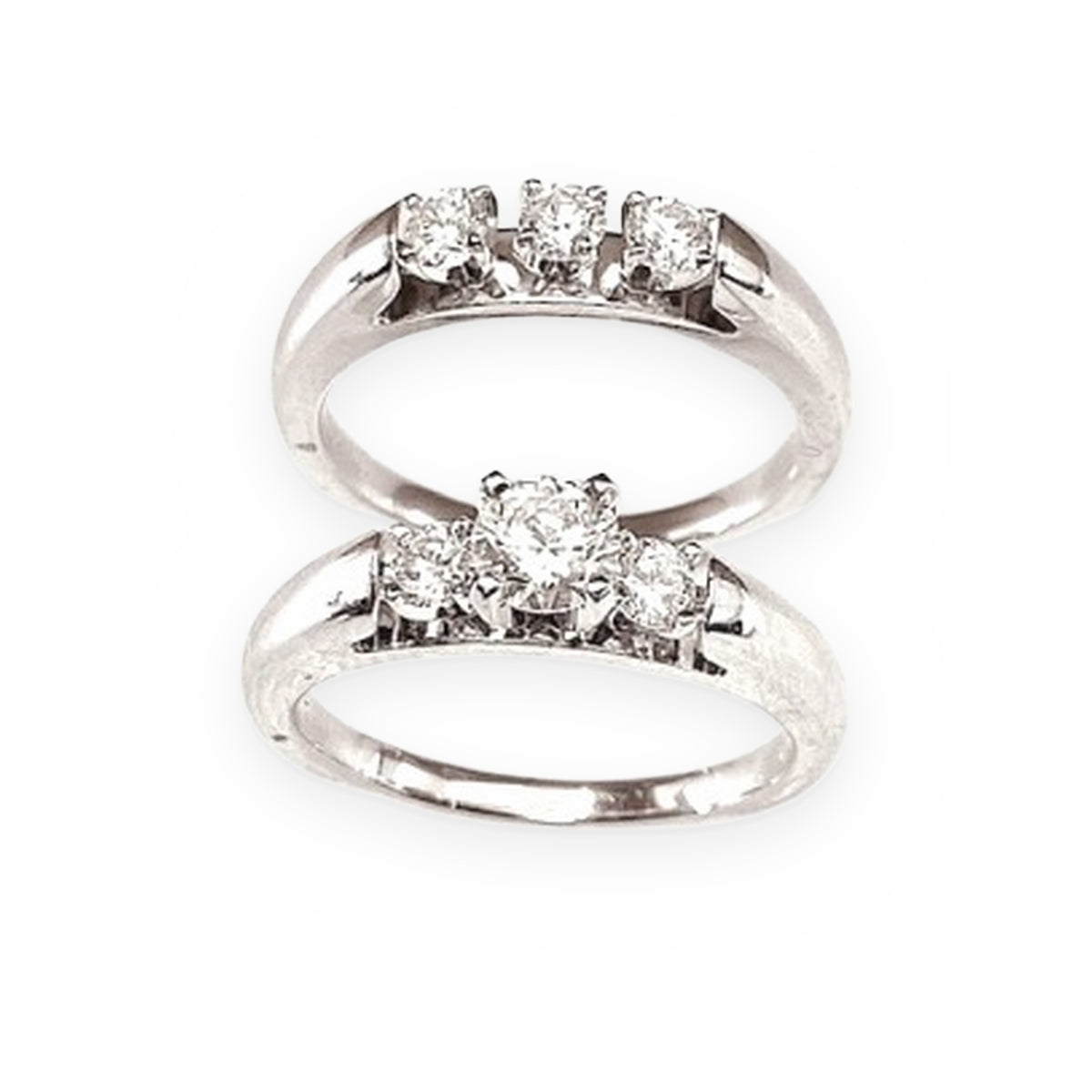 Pair of white gold three-stone diamond rings