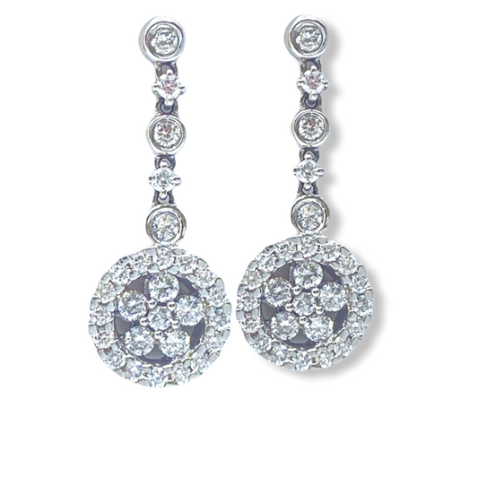 White gold diamond cluster drop earrings with graduated stations