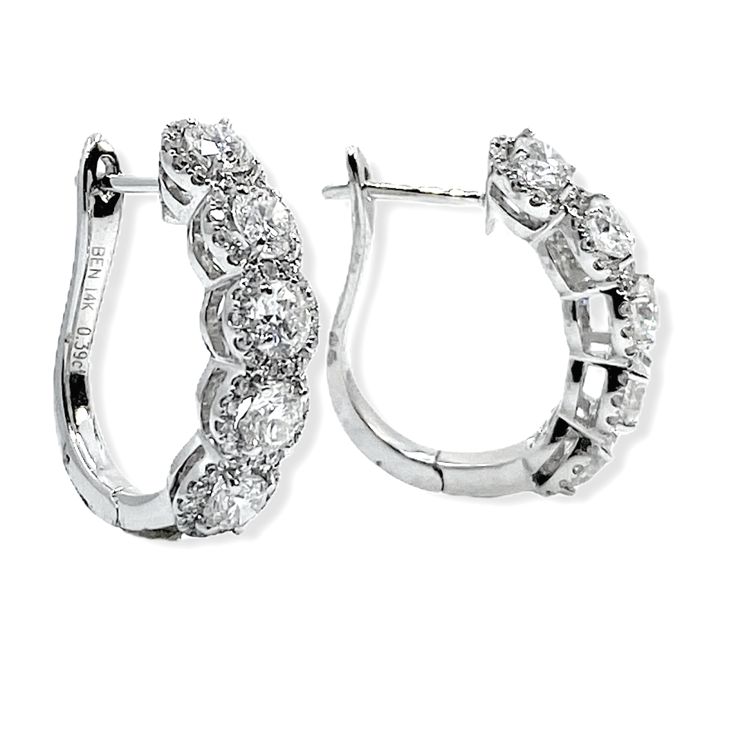 14K white gold graduated diamond hoop earrings with visible carat stamp
