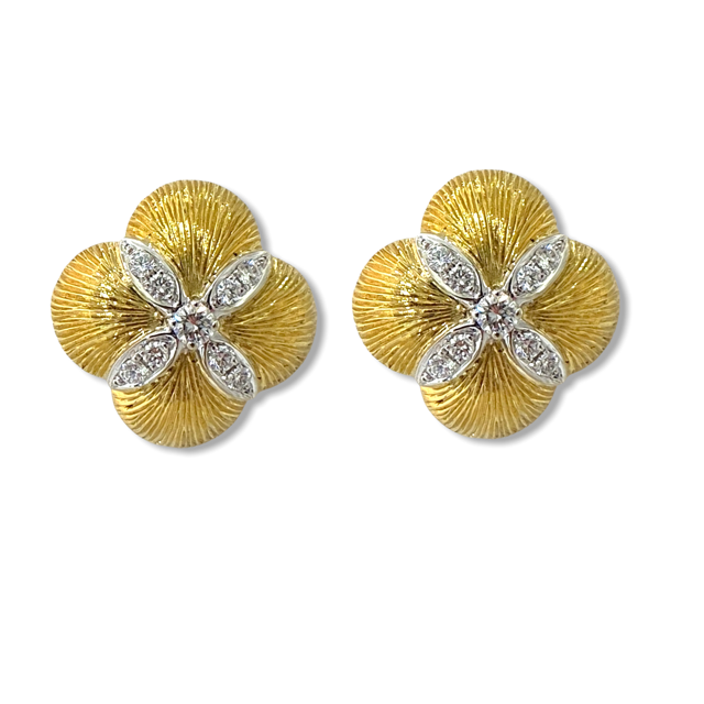 Two-tone gold clover flower earrings with diamond petal center