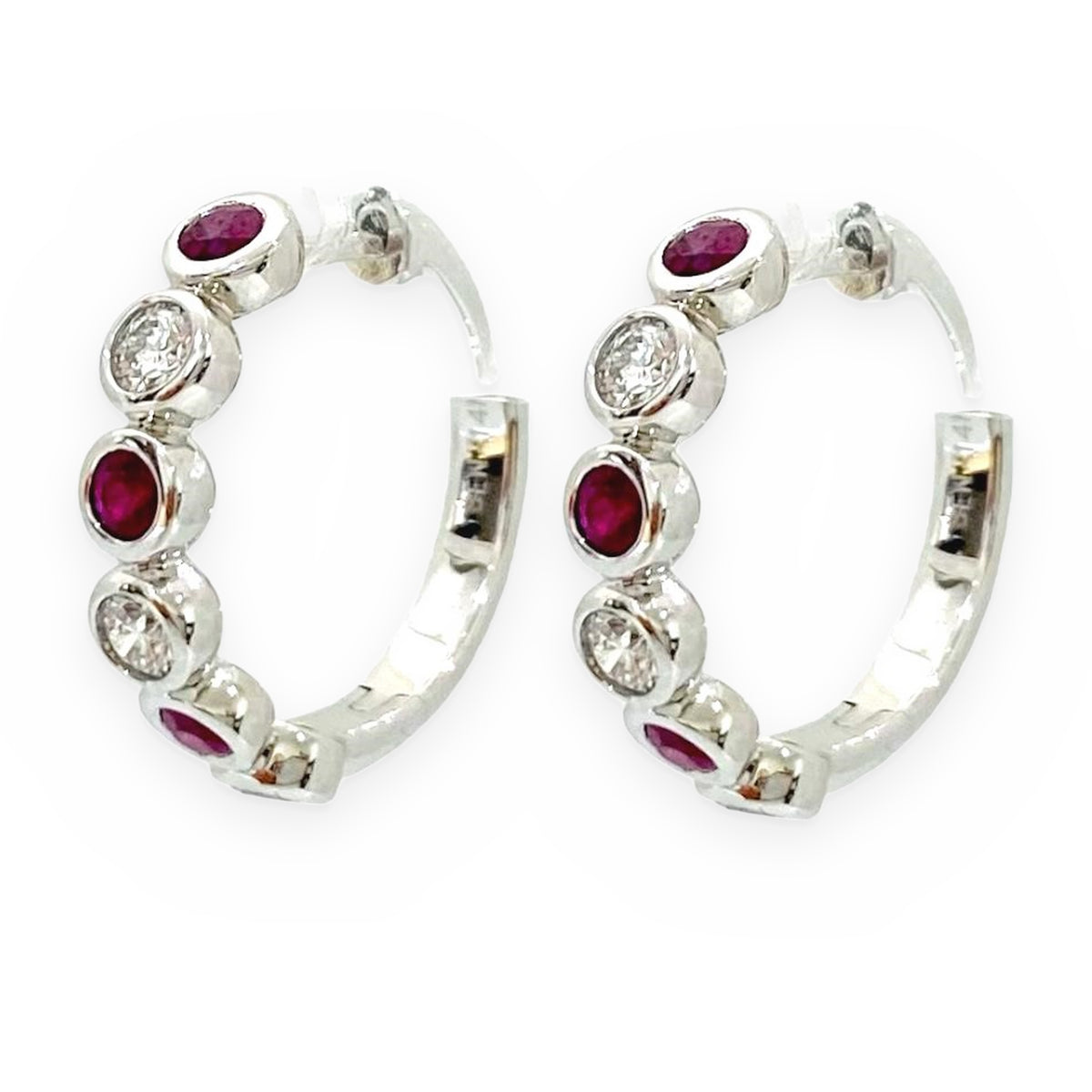 White gold ruby and diamond huggie hoop earrings, side view