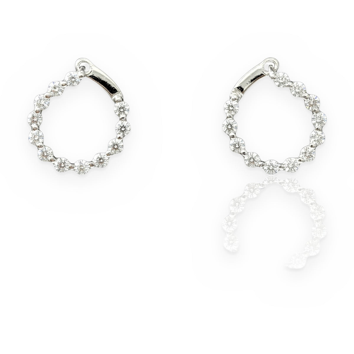 White gold open-circle diamond earrings with reflection