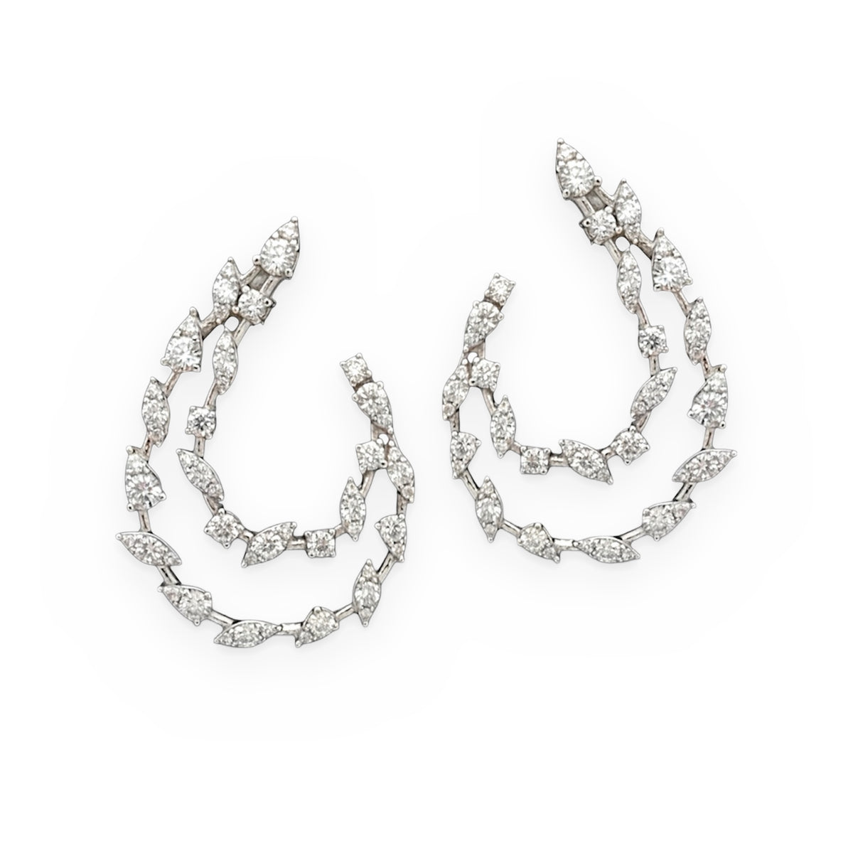 White gold diamond front-facing swirl hoop earrings with marquise clusters