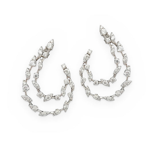 White gold diamond front-facing swirl hoop earrings with marquise clusters