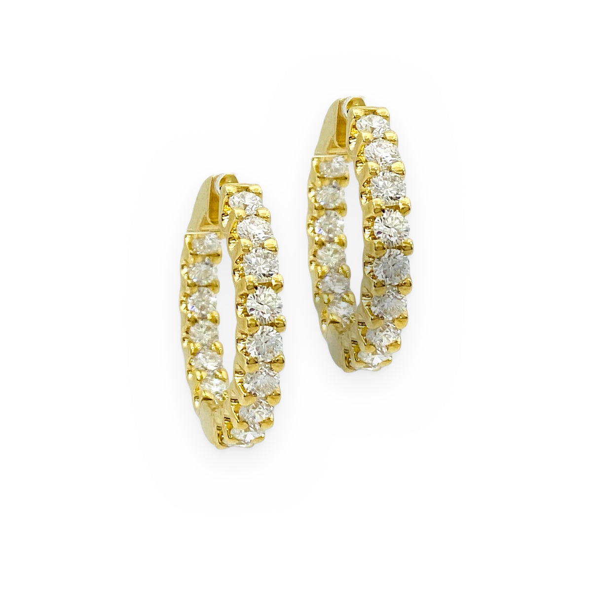 Yellow gold diamond inside-out oval hoop earrings