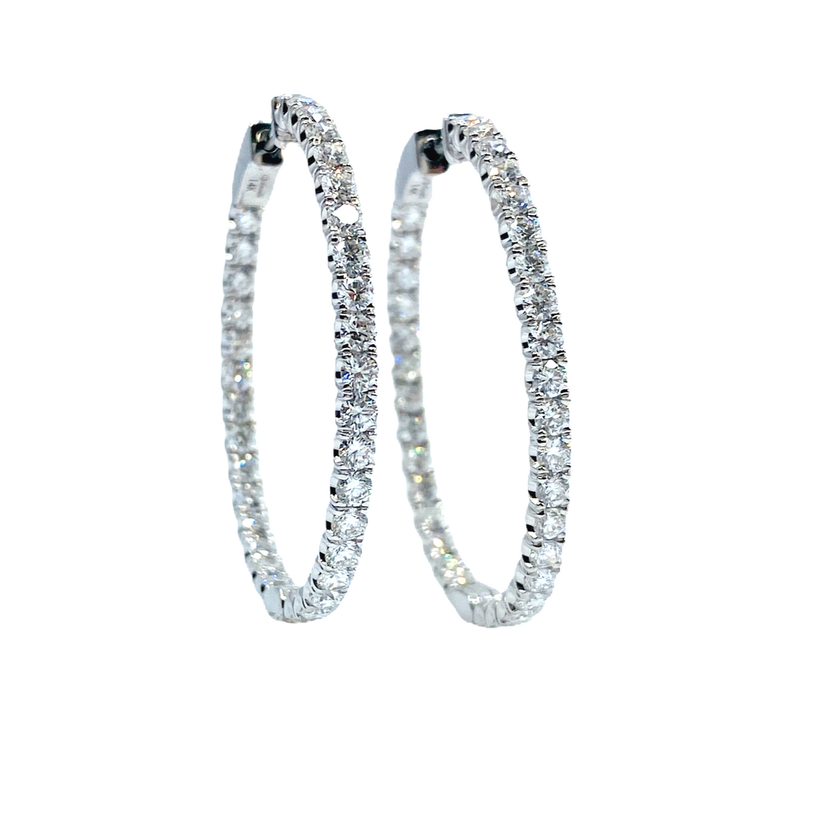 White gold diamond inside-out oval hoop earrings
