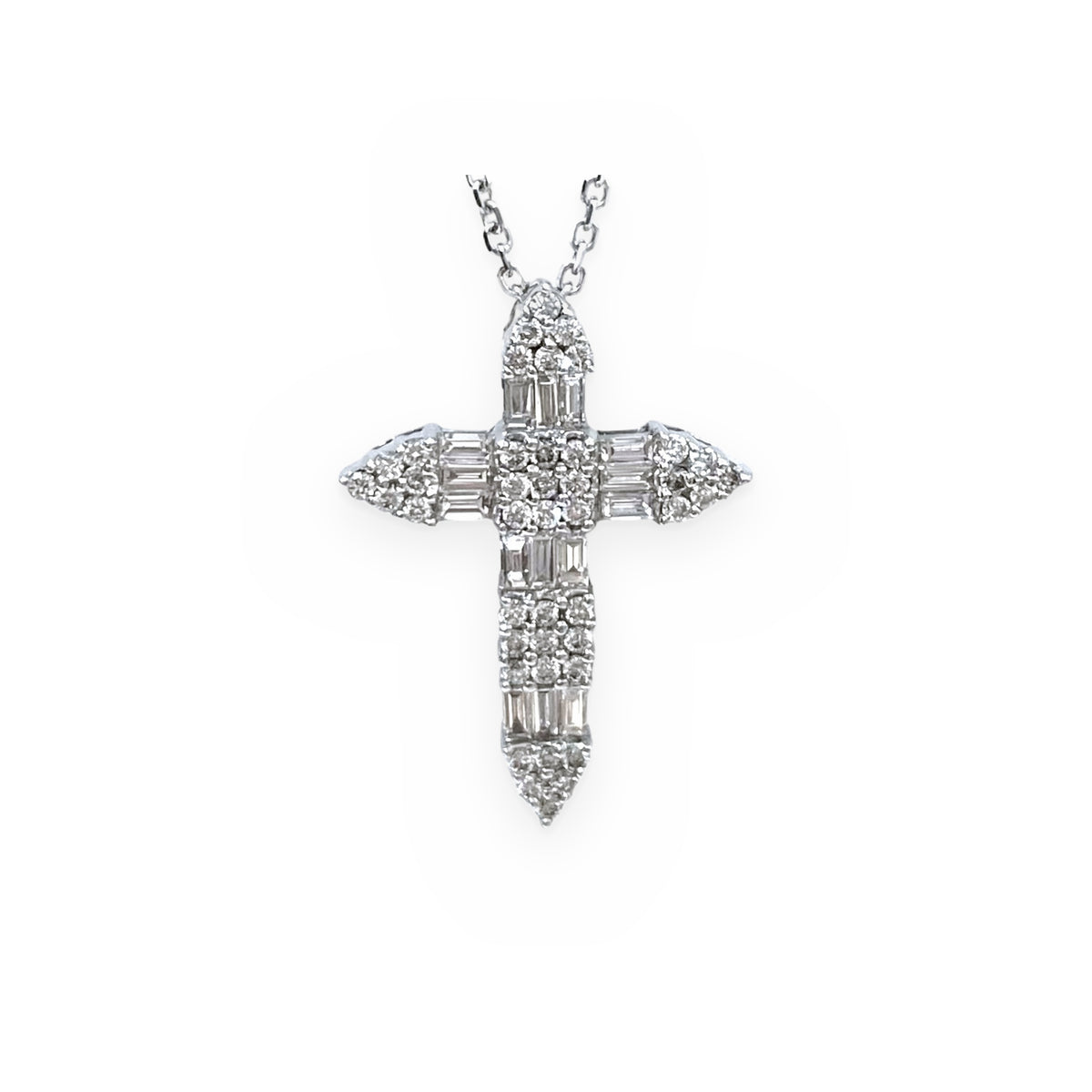 White gold diamond cross pendant with baguette and round diamonds