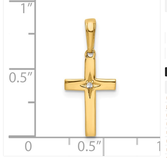 Yellow gold cross pendant shown with inch measurement scale