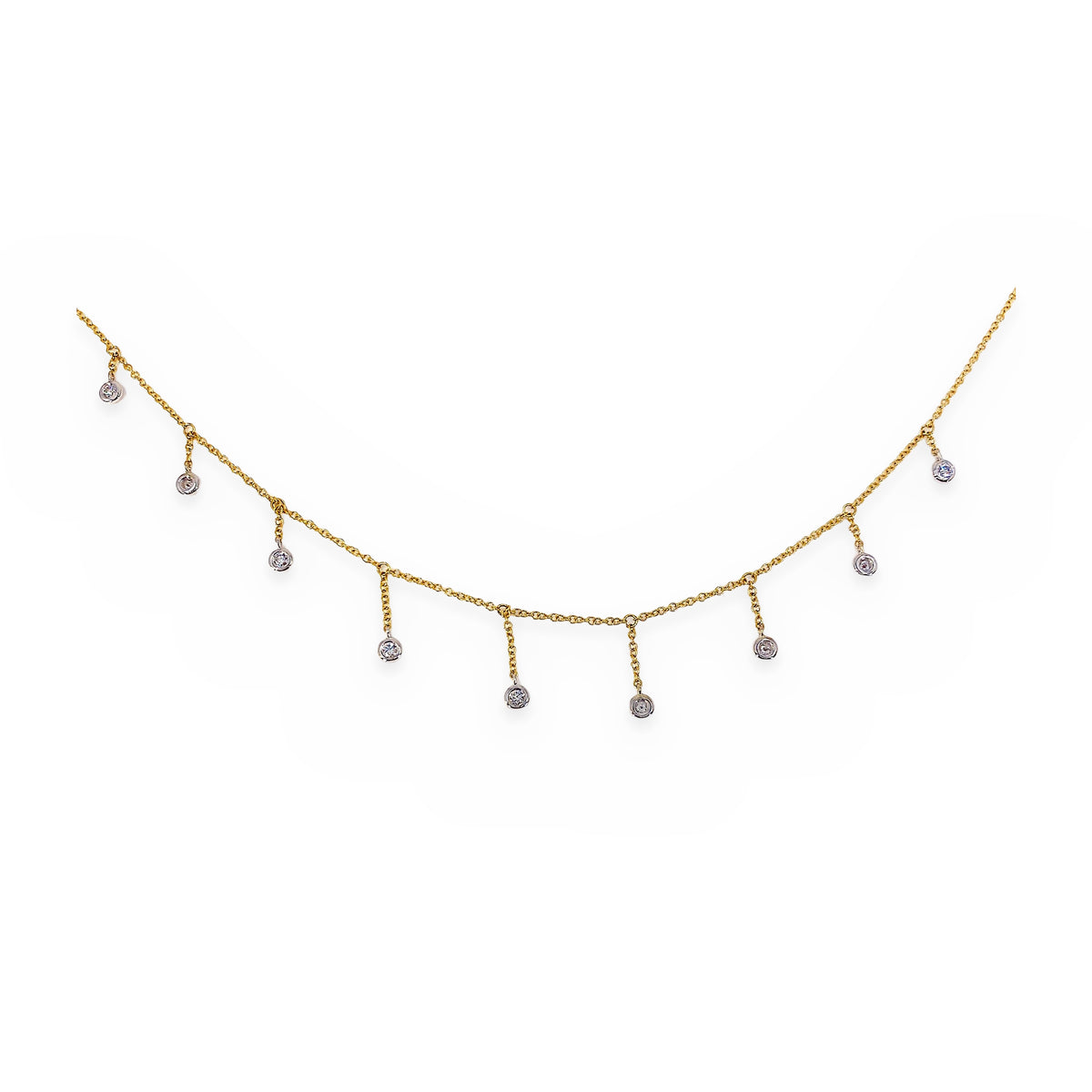 Macro detail of two-tone gold diamond fringe necklace drops