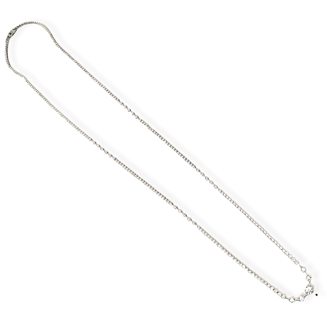 Two-tone gold diamond open-circle pendant with a yellow gold flower on a cable chain