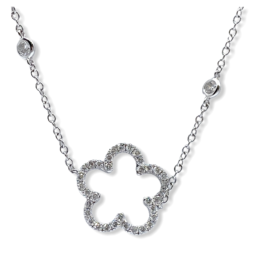 White gold open diamond flower-silhouette pendant on a diamond station chain
