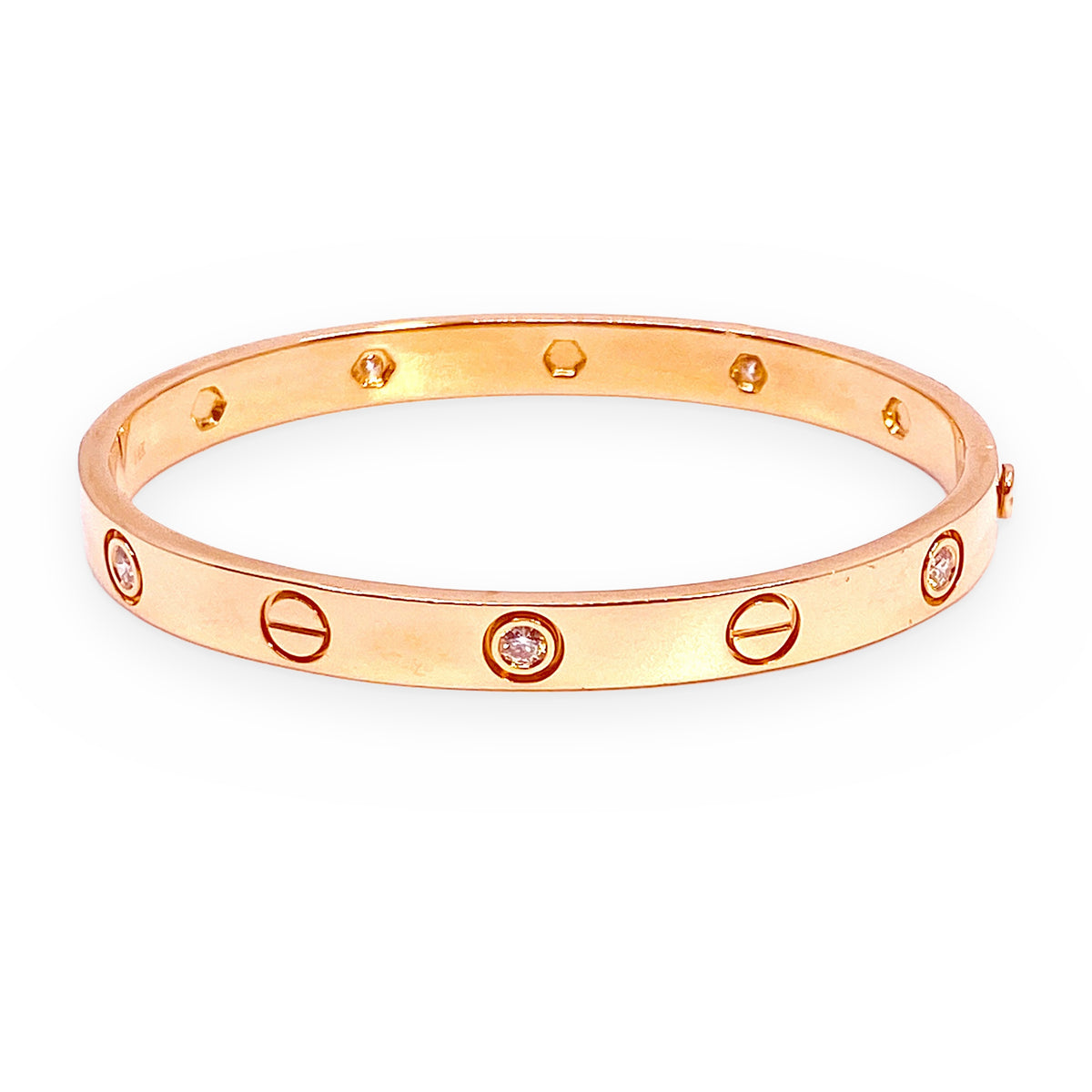 Rose gold love-style diamond and screw-motif bangle at an angle