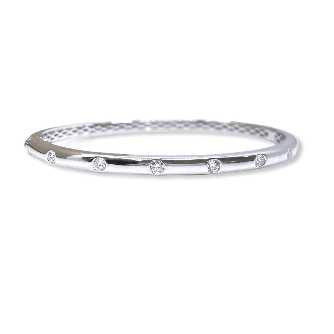 White gold bangle bracelet flush-set with a line of round diamonds