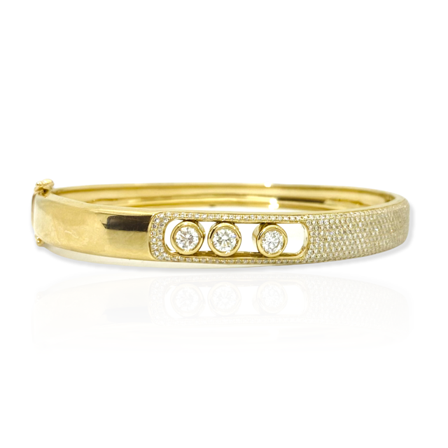 18K yellow gold bangle with pave and three sliding bezel-set diamonds