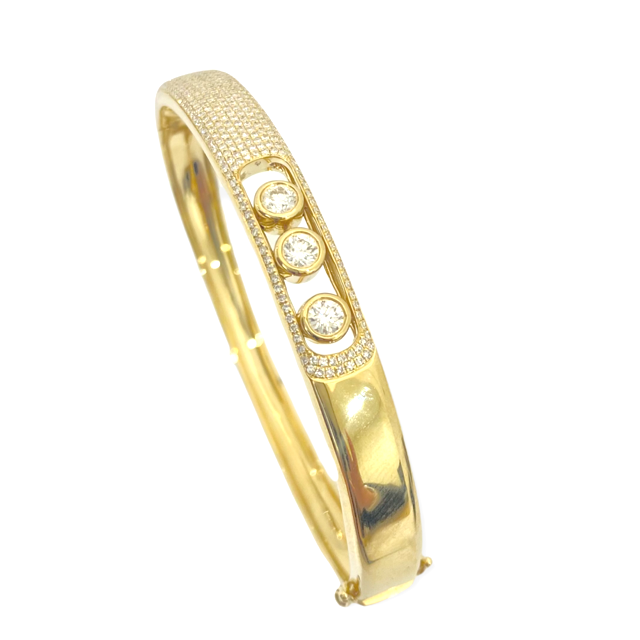 Yellow gold pave diamond bangle with three sliding diamonds, side view