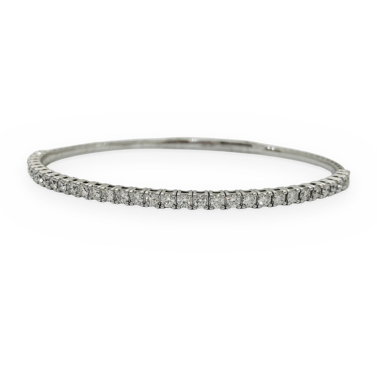 White gold flexible diamond bangle, angled macro view