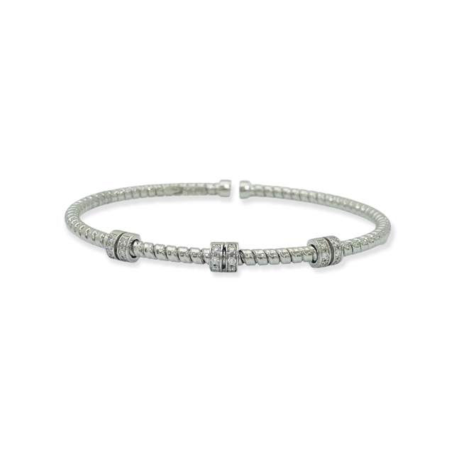 White gold flexible cuff with three pave diamond rondelle stations