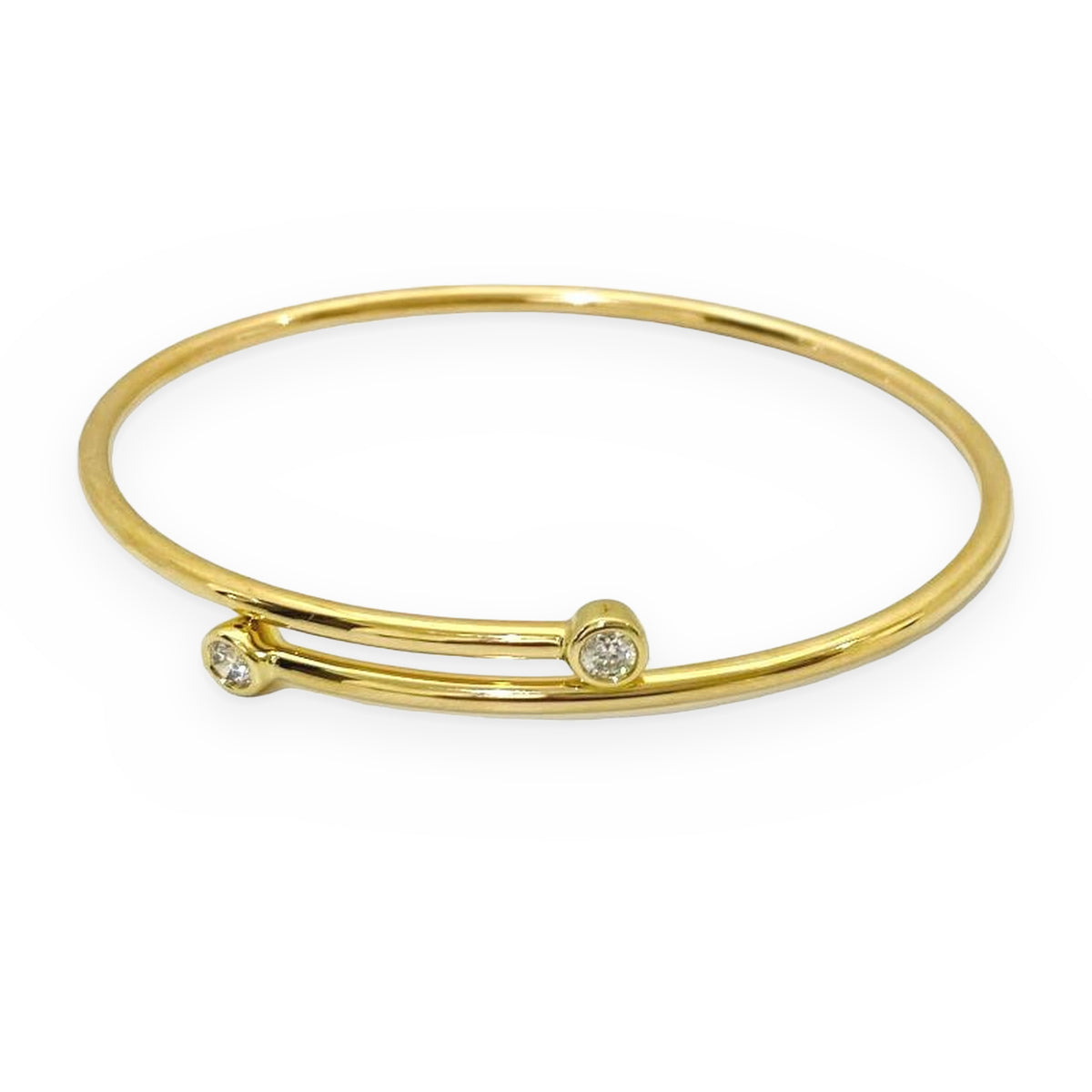 Yellow gold bypass wire bangle with diamond ends, alternate view
