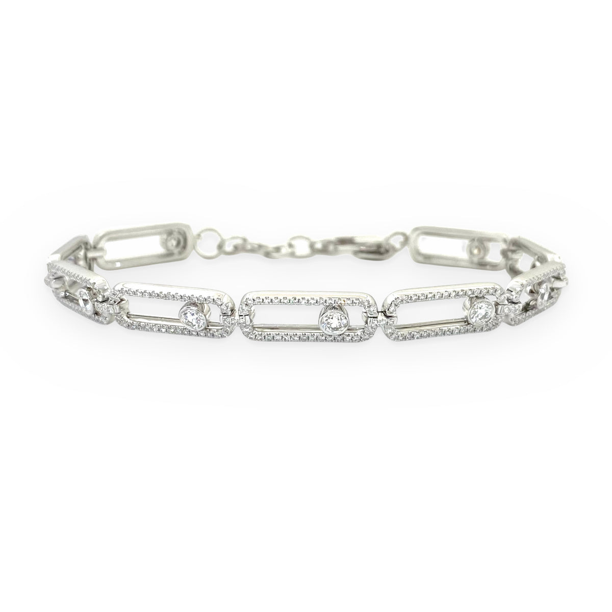 White gold open link bracelet with pave frames and floating bezel diamonds