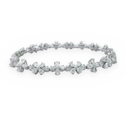 White gold diamond floral cluster bracelet with pear and round diamonds