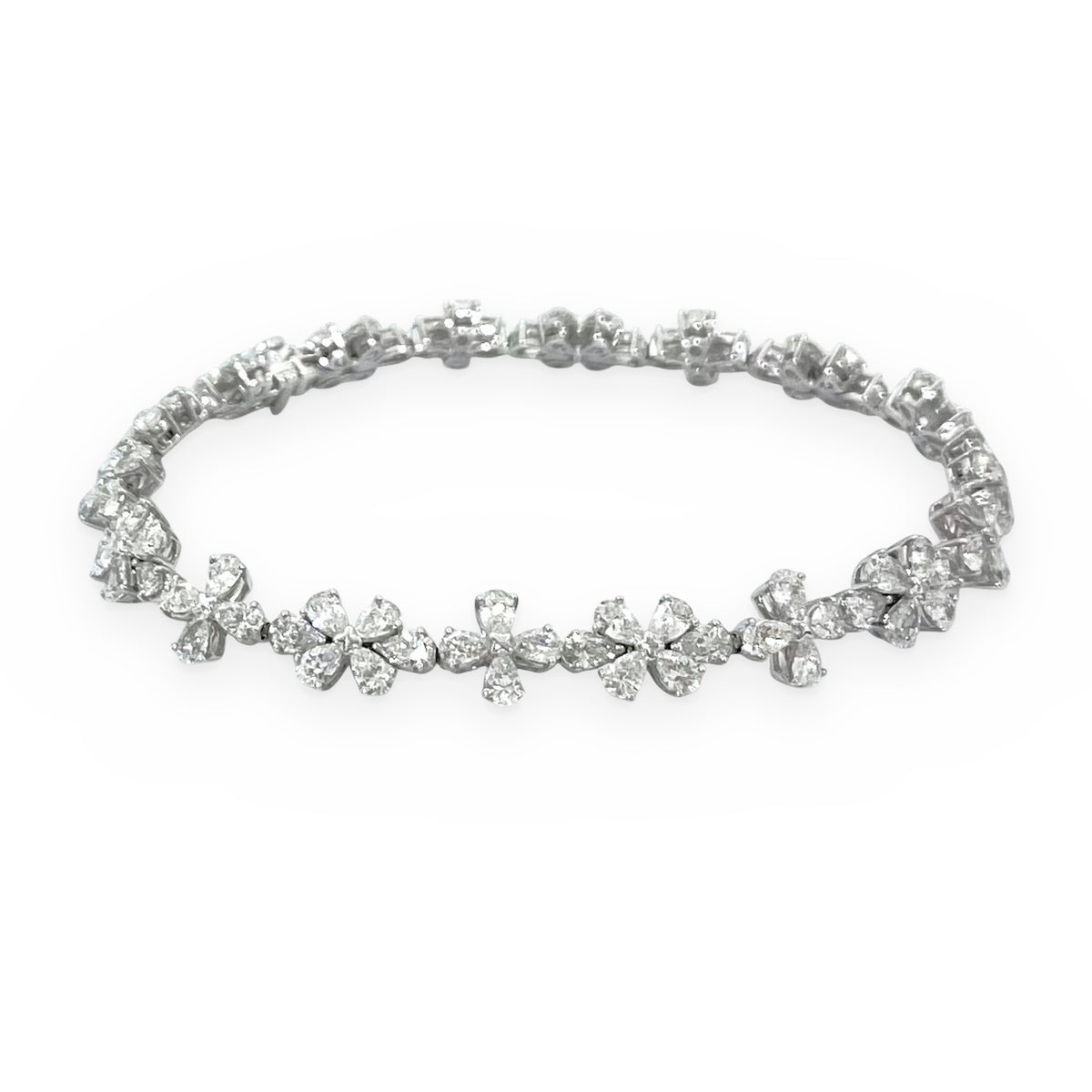 White gold pear and round diamond floral cluster bracelet