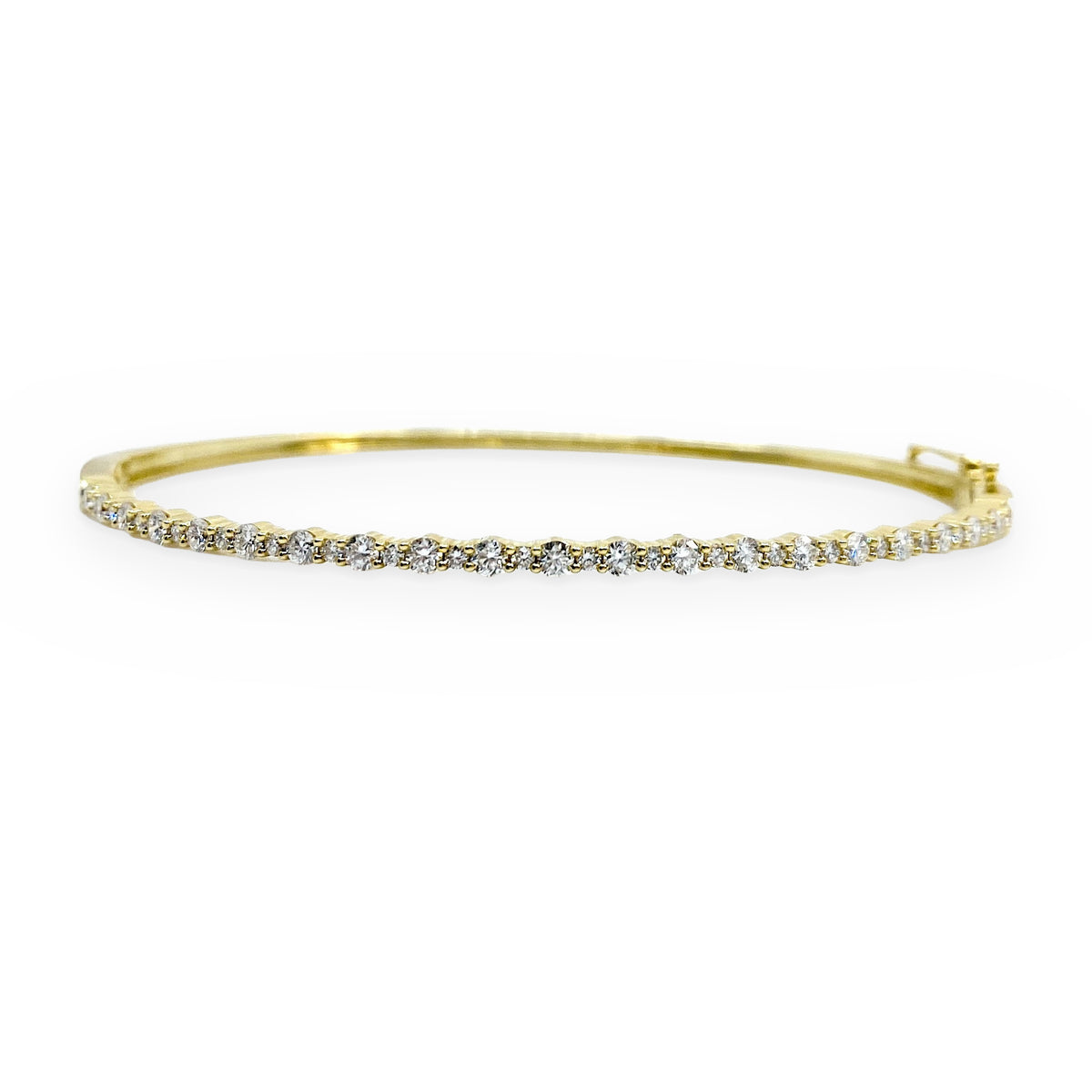 Yellow gold flexible diamond bangle with prong-set round diamonds
