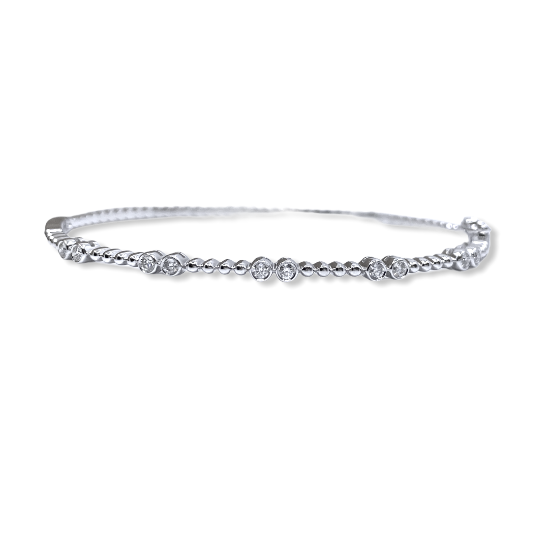 White gold beaded flexible bangle with bezel-set diamond pairs