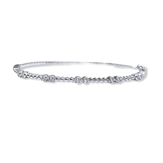 White gold beaded flexible bangle with bezel-set diamond pairs