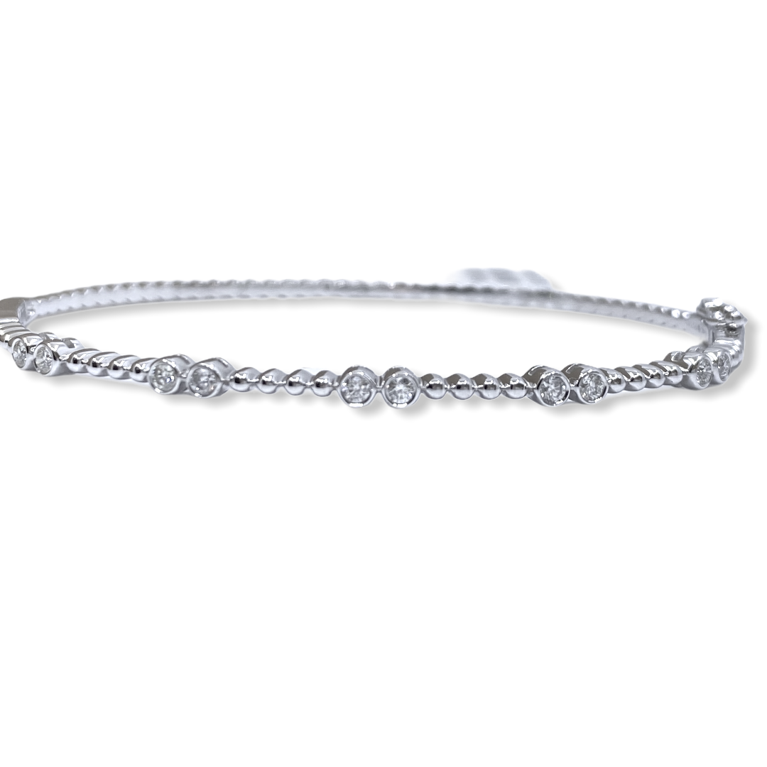 White gold beaded bangle with bezel-set diamond stations, front view