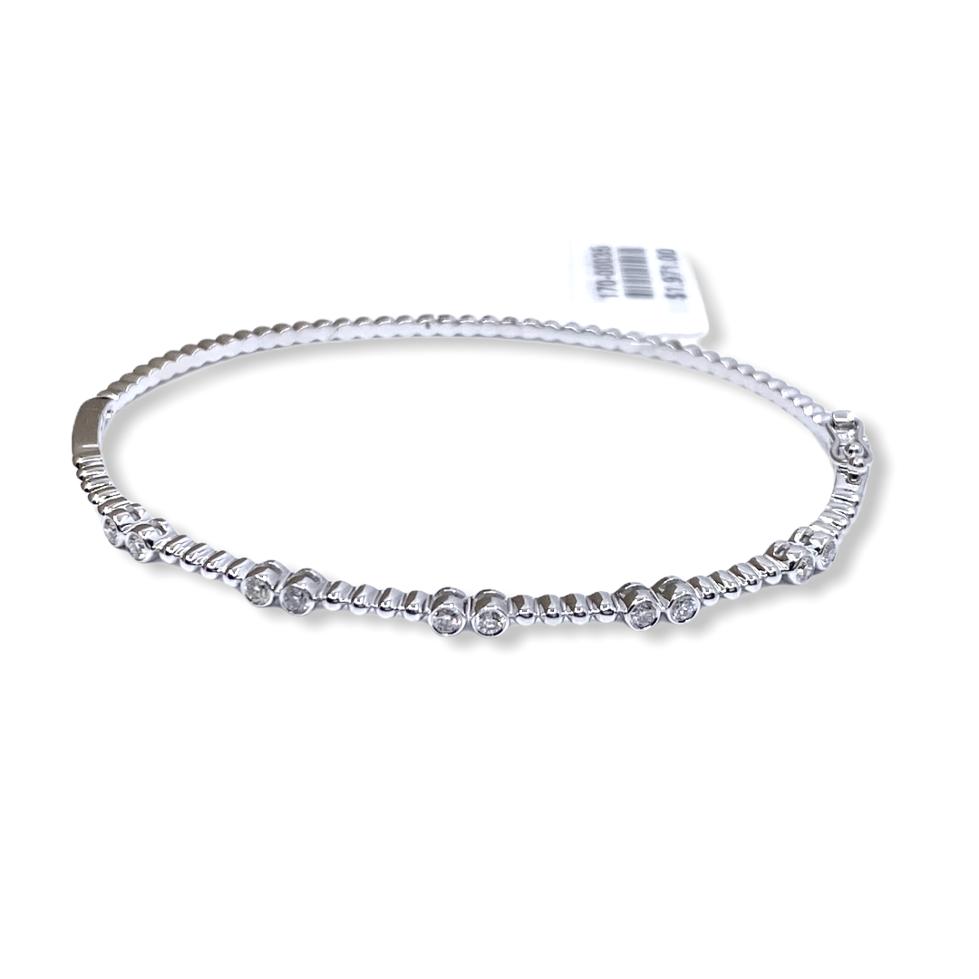 White gold beaded diamond bangle with attached stock price tag