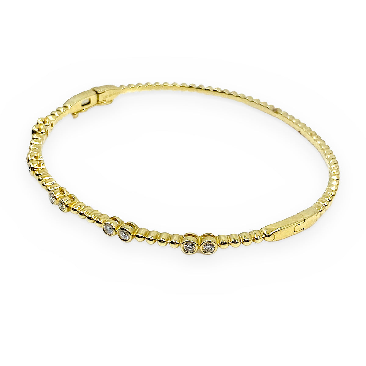 18K yellow gold beaded diamond bangle shown at an angle with clasp visible