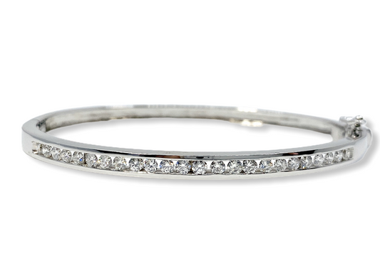 White gold channel-set diamond bangle bracelet with a row of round diamonds