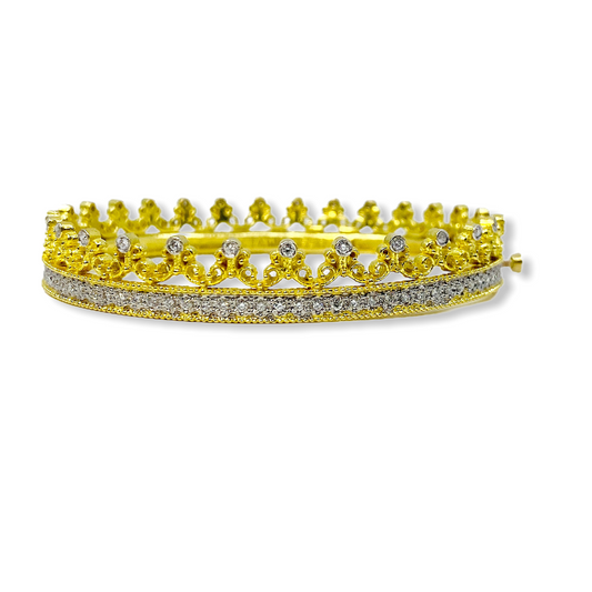 Two-tone gold crown bangle with a pave diamond band and filigree crown detail