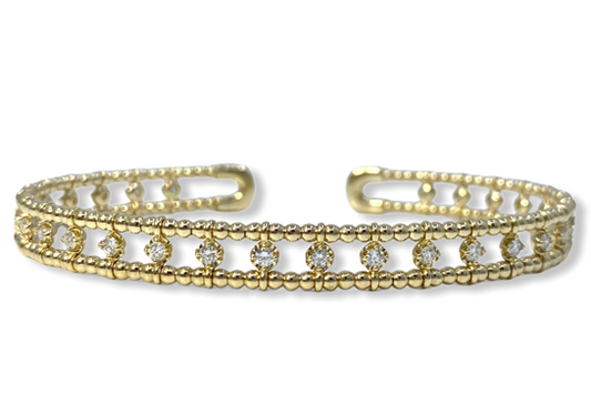 Yellow gold beaded cuff bracelet with a row of bezel-set round diamonds