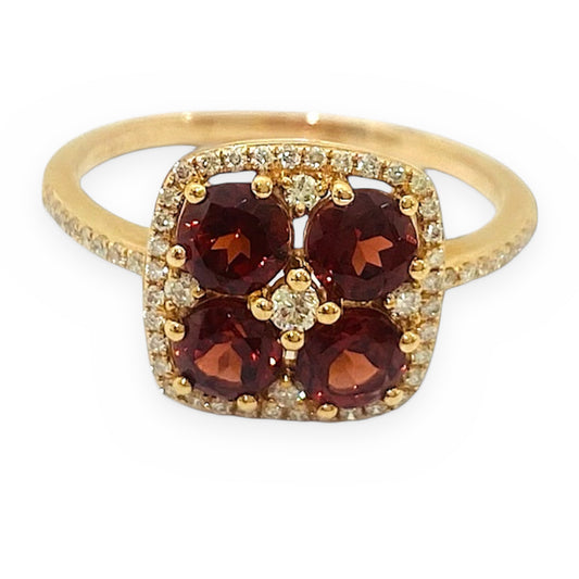 Yellow gold ring with a four-stone garnet cluster and diamond halo
