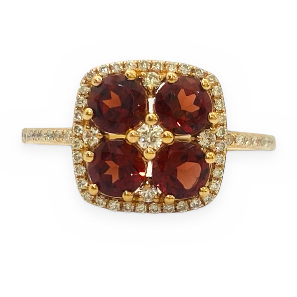 Yellow gold four-stone garnet cluster ring with diamond halo, front view